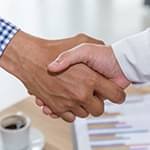 Support specialist helping client at workplace