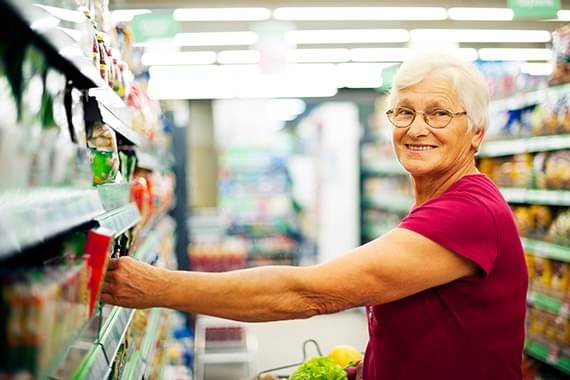Woman working in a supermarket after returning to work through the Ticket to Work program